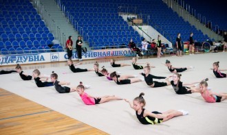 At what age can you start training in rhythmic gymnastics?